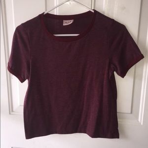 A maroon slightly cropped shirt. Fitted.